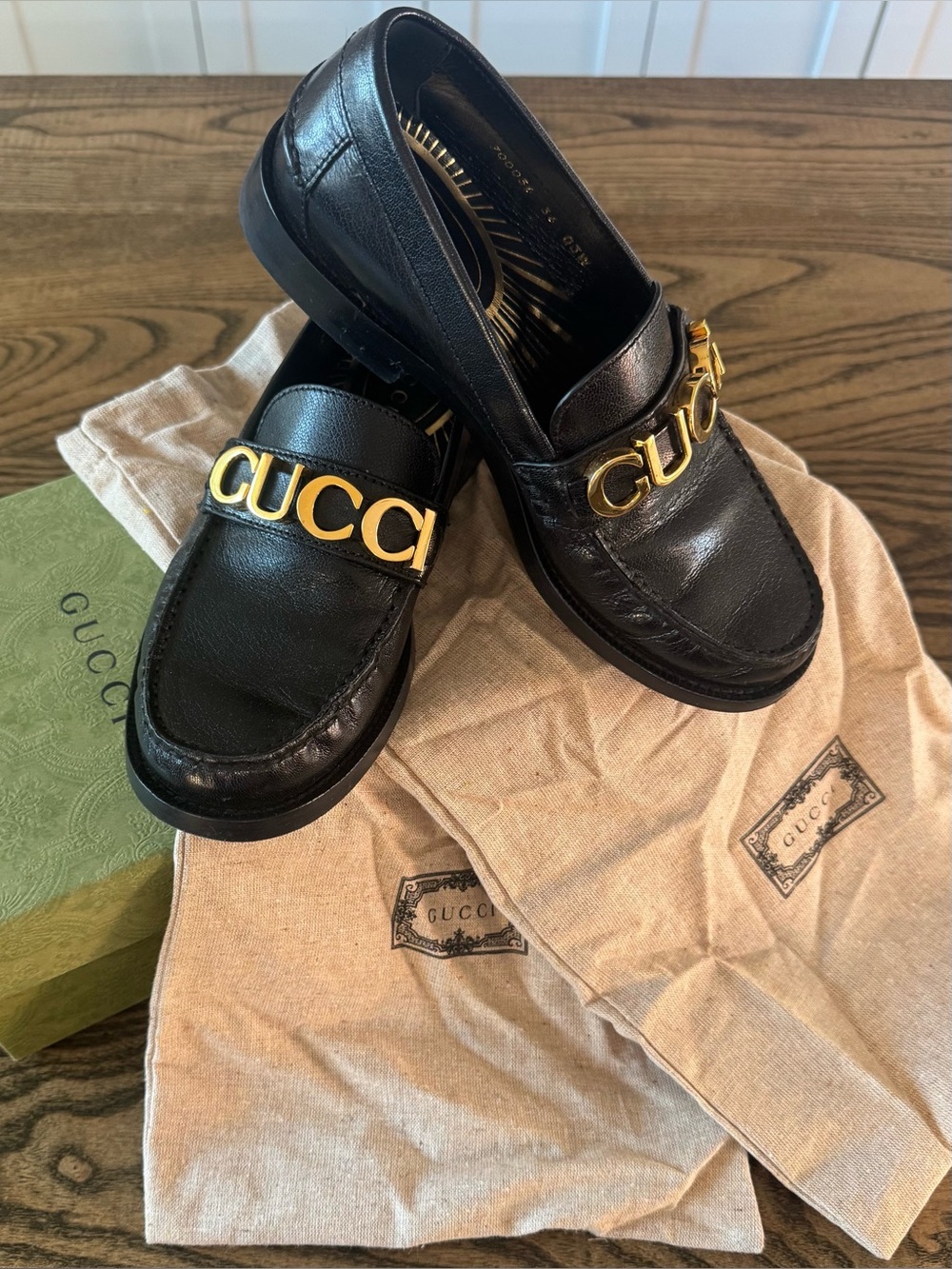 Gucci Black Leather Women’s Loafers with Gold Logo Hardware